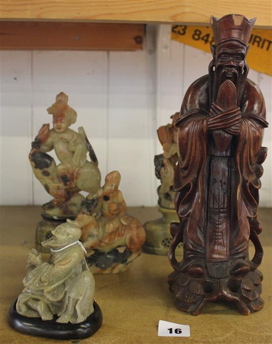 Chinese carved hardwood figure of an Immortal & four various carved soapstone figures (faults)